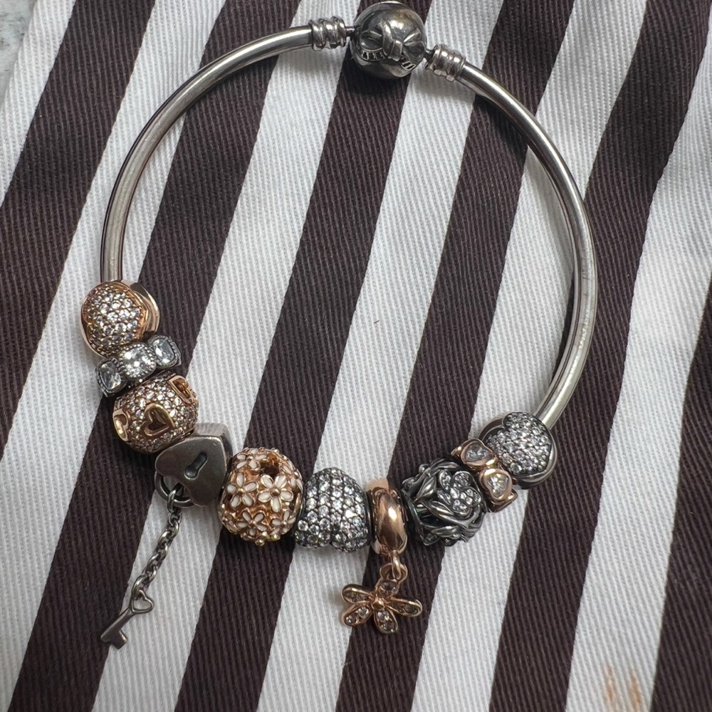 Sterling silver & rose gold pandora bangle. Bracelet needs to be cleaned.